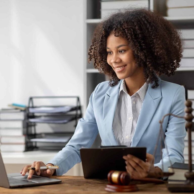 Lawyer reviewing documents at her desk